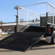 lawn mowing trailer with spring assist drop ramp